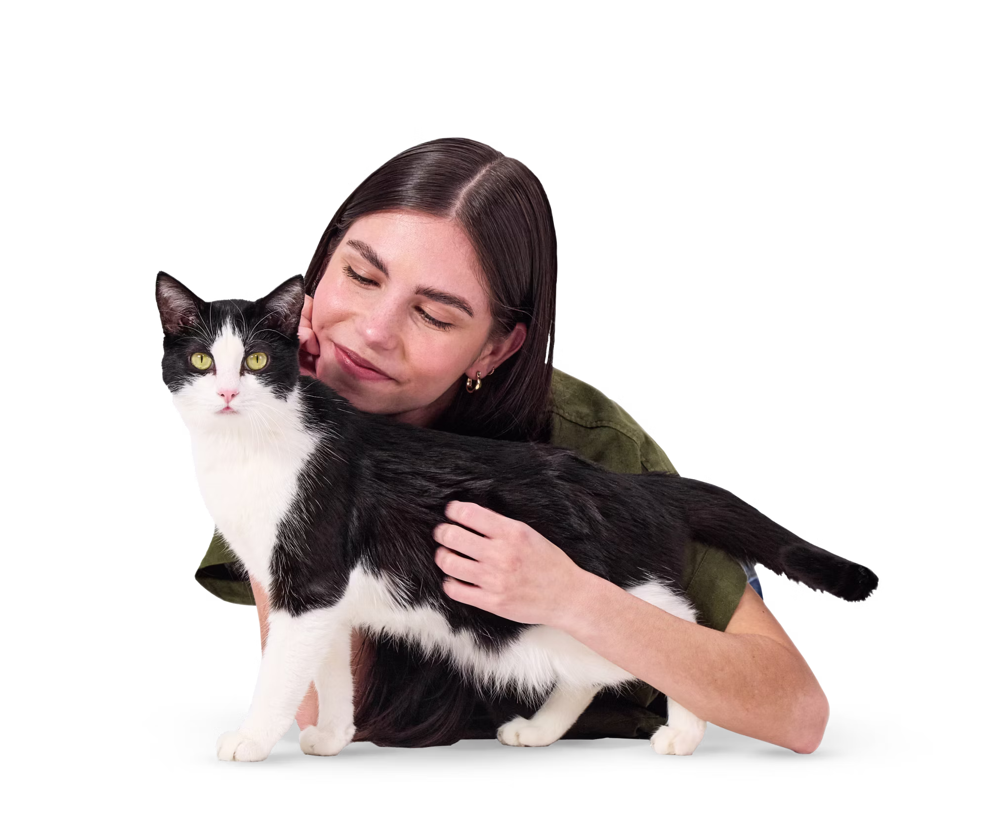 Woman smiling at black and white cat