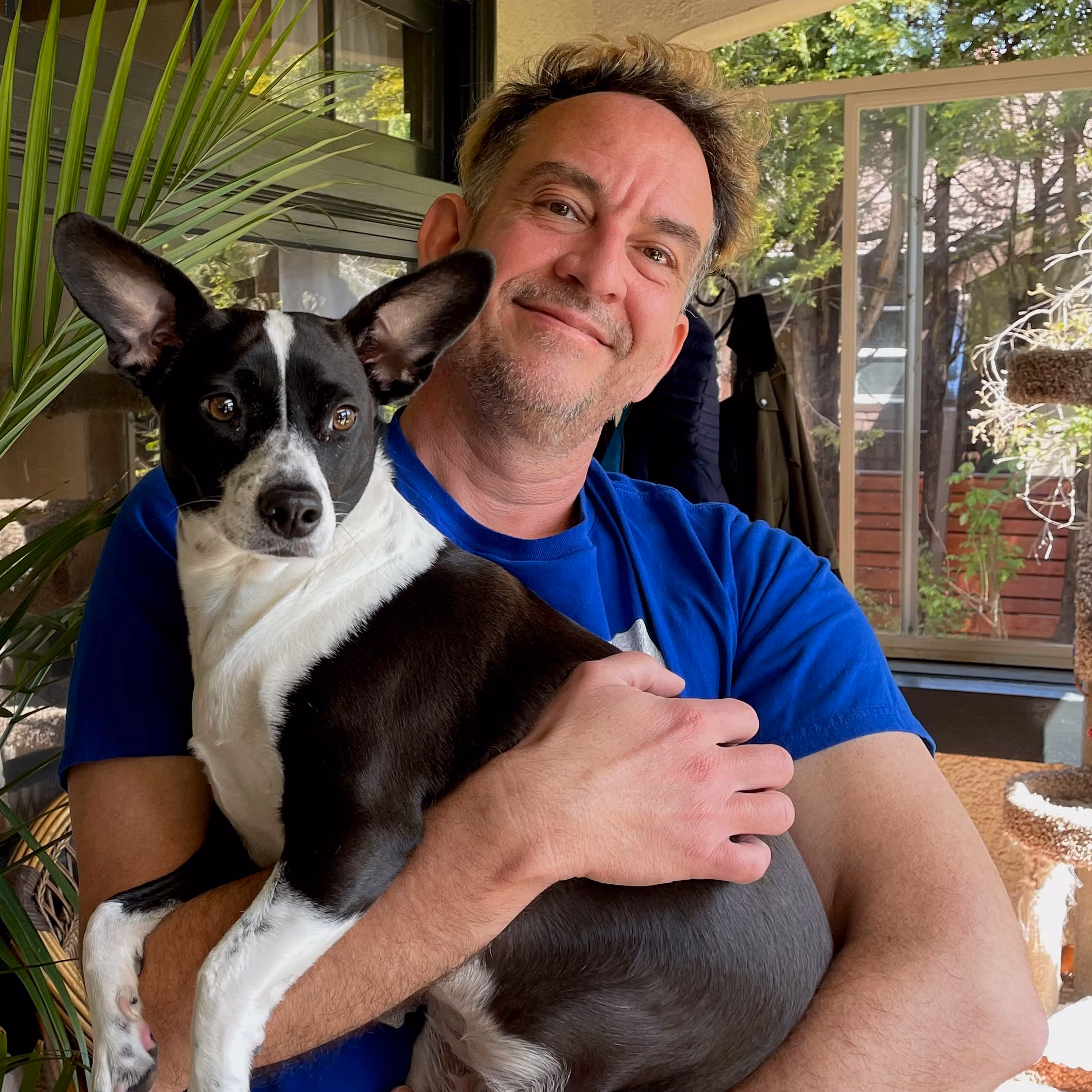  Dan Garrigan holds a cute black and white dog